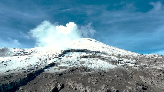 Nevado del Ruiz Snow Covered Volcanic Summit in the Colombian Andes. Establishing Shot. Aerial View.