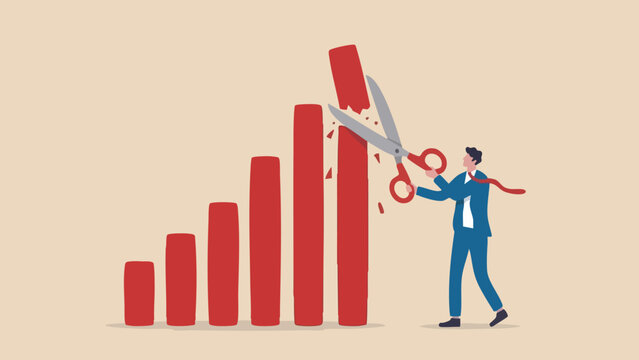Businessman in a blue suit using large scissors to cut the off a red bar chart graph
