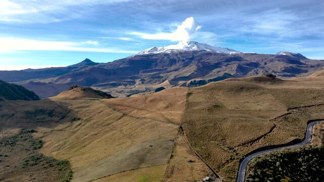 Nevado del Ruiz Volcano with Visible Volcanic Plume over the Colombian Andes. Establishing Shot. Aerial View.