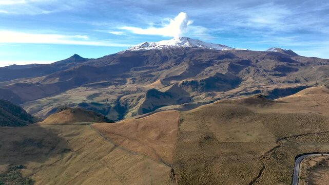 Nevado del Ruiz Volcano with Visible Volcanic Plume over the Colombian Andes. Establishing Shot. Aerial View.
