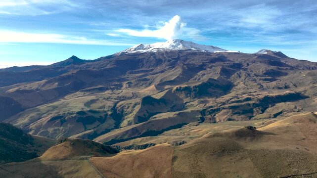 Nevado del Ruiz Volcano with Visible Volcanic Plume over the Colombian Andes. Establishing Shot. Aerial View.