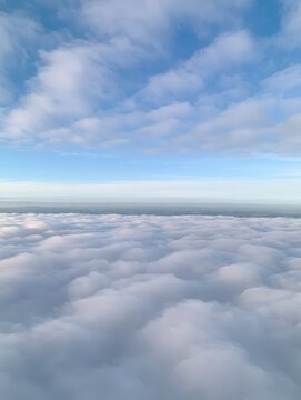 Aerial view above a vast sea of clouds