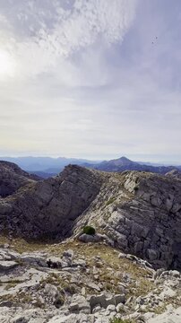 Cinematic Drone Perspective of Misty Mountain Ridges in Golden Sunset Light