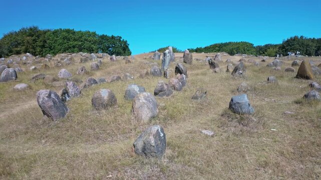 Lindholm Hoje is a major ancient Viking burial site and former settlement north of Aalborg, Denmark. Walking, motion