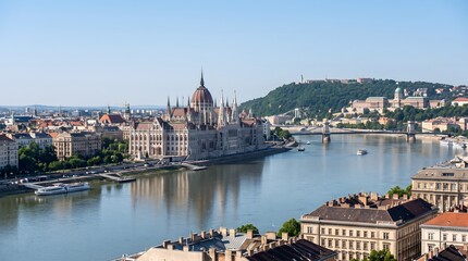 Fototapeta premium Danube Splendor: Elevated View of the Hungarian Parliament Building, Buda Castle, and Széchenyi Chain Bridge in Budapest