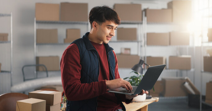 Smile, man and laptop in small business for shipping, route search or waybill review in logistics. Startup, person or typing on tech for fleet tracking, delivery status update or inventory management
