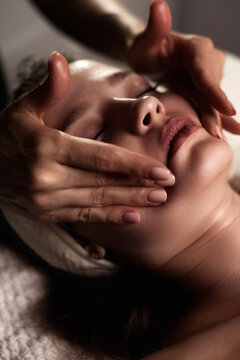 Woman Receiving a Facial Massage in a Beauty Clinic Indoors