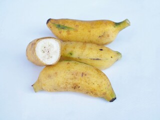 Ripe bananas placed on a white surface  a healthy Thai fruit. © Lookjeabka