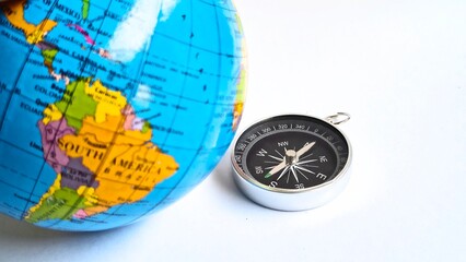Magnetic Compass with Planet Earth Globe Travel Navigation Concept Close Up © Yosep