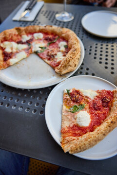 Delicious Neapolitan Pizza Served on a Terrace Table in an Outdoor Cafe