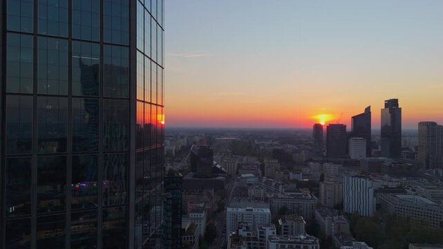 Aerial Drone Footage of Warsaw City Center Skyline and Skyscrapers at Sunset