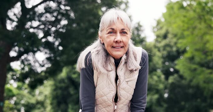 Tired, watch and happy with old woman in park for fitness stats, heart rate monitor or runner target. Training goal, workout break and progress check with senior person outdoor with health tech