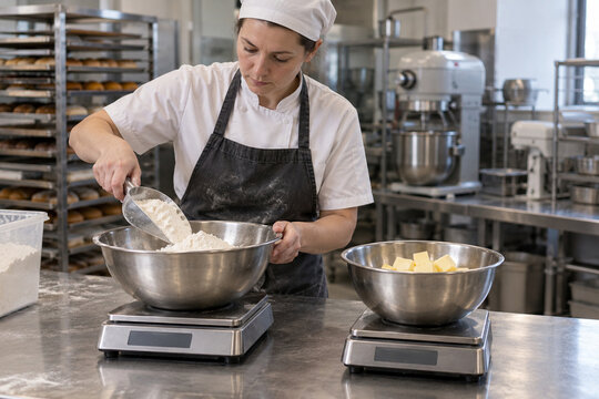Baker weighs ingredients for commercial production batch