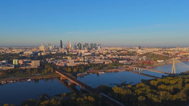 Aerial Drone View of Warsaw City Center and Vistula River at Sunrise with Cable-Stayed Bridge