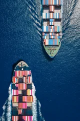 Aerial overhead view of two container cargo ships sailing over the ocean as a concept for logistics and transport © moofushi