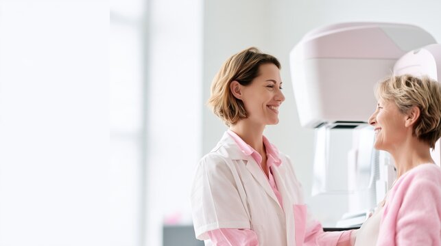 National Mammography Day: wide banner photograph of a female radiologic technologist calmly preparing a smiling woman patient beside a modern digital mammography unit