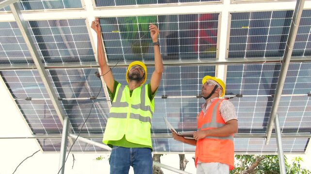Engineers inspecting solar panels in Farrukhabad Uttar Pradesh India
