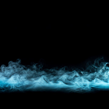 Mystery atmospheric ground fog illuminated by blue backlight on black background