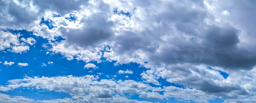 A raster image of a some cloud photographed against a blue sky. Easy relaxed cottony shape. Background quiet sky. Fiber contours after rain. Lonely free substance water. Trivial form of freedom.