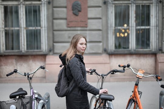 A woman rents a bike.