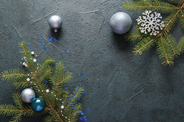 Fototapeta premium Fir branches with Christmas balls and snowflake on dark background