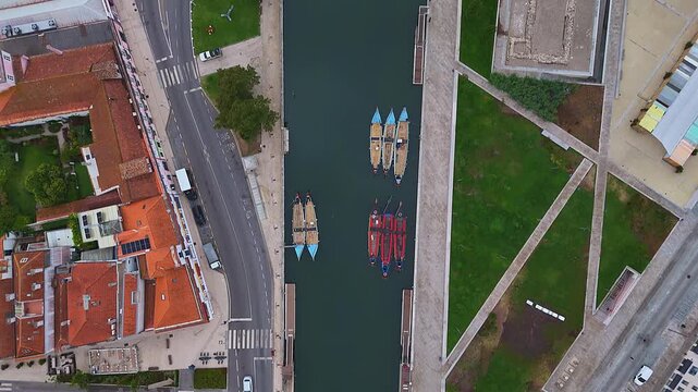 Bird's-Eye View of Traditional Moliceiro Boats Moored Along a Calm Canal in Aveiro, Portugal