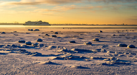 Winter sunrise over frozen sea with distant cruise ship © Fabio