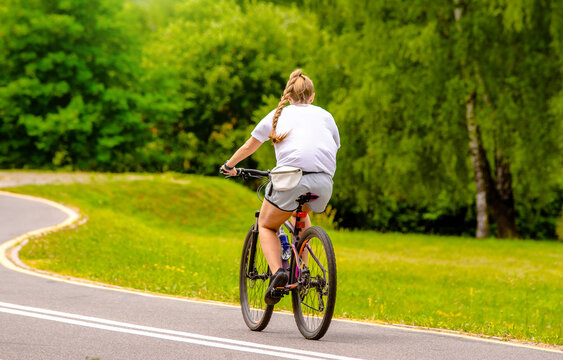 Cyclist ride on the bike path in the city Park
