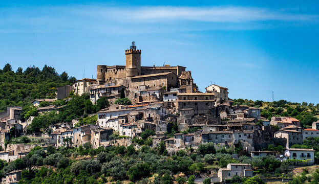 Medieval Hilltop Village with Castle and Scenic Landscape