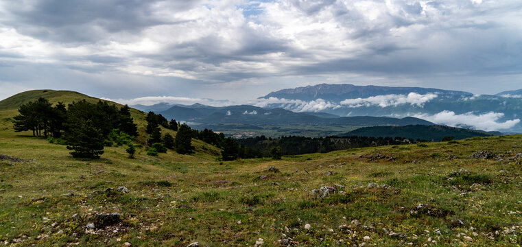 Panoramic Mountain Landscape Under Cloudy Sky