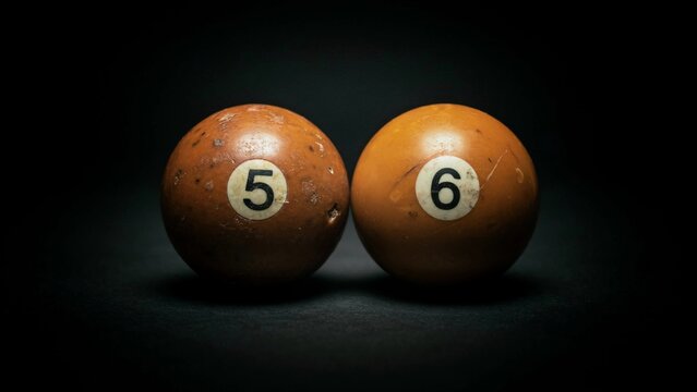 Vintage Billiard Balls Number Five and Six on Black Background