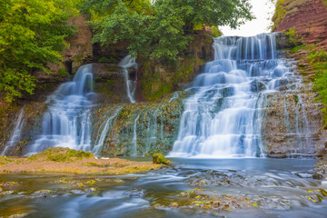 beautiful small waterfall on the river © Yuriy Kulik
