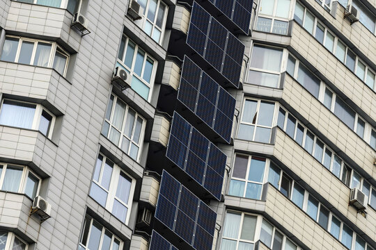 Solar panels and a battery storage system mounted on a modern apartment building in Kyiv, Ukraine, providing renewable energy and backup power for residential use.