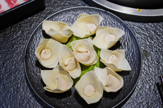 The spare wonton in a black plate, traditional Chinese food
