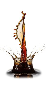 A dramatic crown of dark brown coffee splashing upwards with fine droplets and mist, isolated on a clean white background for design, macro, ingredient, java