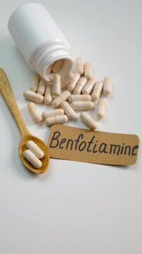 Benfotiamine capsules and vitamin supplements. Selective focus.