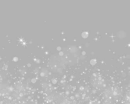 Silver sparkle particles scatter dynamically across a black background. The glowing spots vary in softness, size, and intensity with bright starbursts.