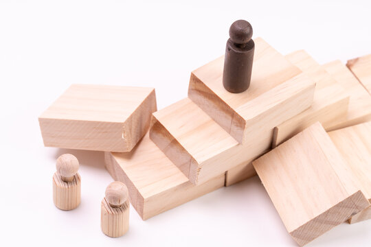 Business setback and failed strategy concept with wooden people.