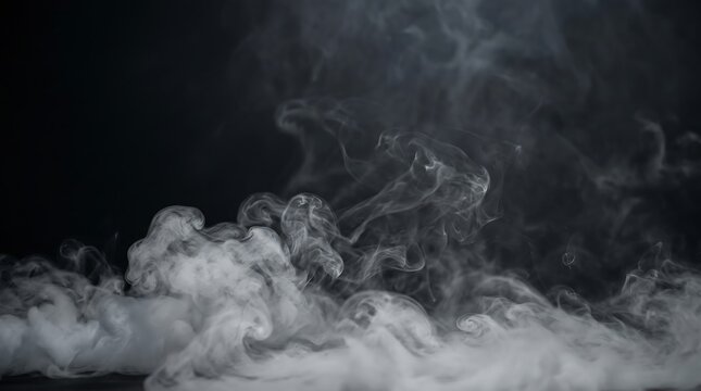 Wispy white smoke clouds rising against a dark solid black background creating a mysterious and atmospheric texture for abstract design projects