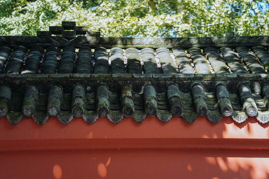Red Wall With Shadow Of Bamboo Leaves In Chinese Garden