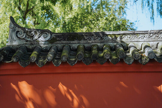 Red Wall With Shadow Of Bamboo Leaves In Chinese Garden