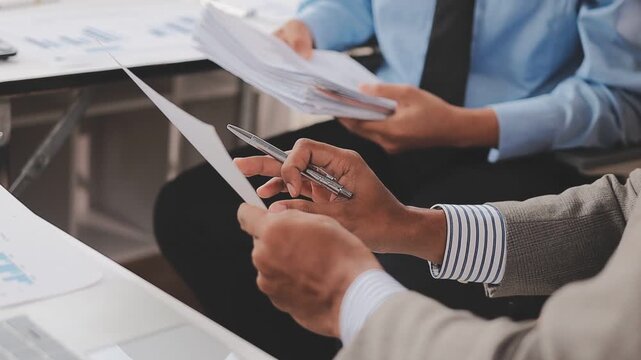 Meeting of the Asian business team To analyze and discuss the situation in financial reports in the conference room. investment consultant financial advisor and accounting concepts.