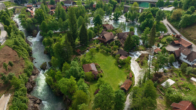 Drone captures beautiful canyon village of Rastoke near Slunj. Rapid rivers, waterfalls, and traditional wooden watermills integrate perfectly with lush green nature in famous Croatian landmark.