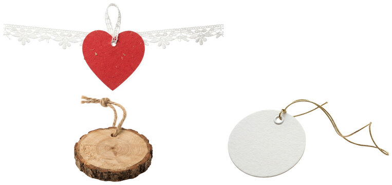 A collection of decorative gift tags in varied shapes and materials, each tied with a different type of string for wrapping presents.
