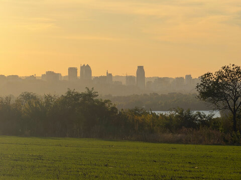 Dnipro City skyline horizon river green field sunset landscape in Ukraine