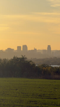 Dnipro City skyline horizon river green field sunset landscape in Ukraine