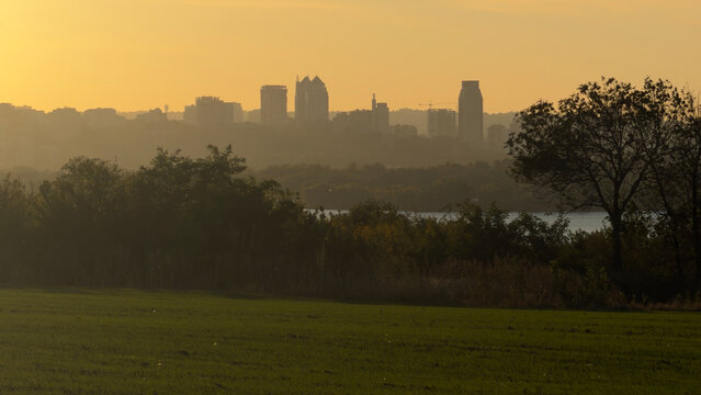 Dnipro City skyline horizon river green field sunset landscape in Ukraine
