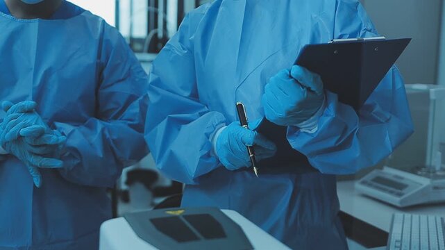 Food scientists in lab coats, testing samples, and analyzing food safety and quality in a modern laboratory