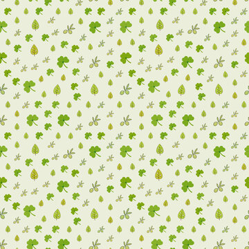 Seamless pattern of green clovers and olive branches