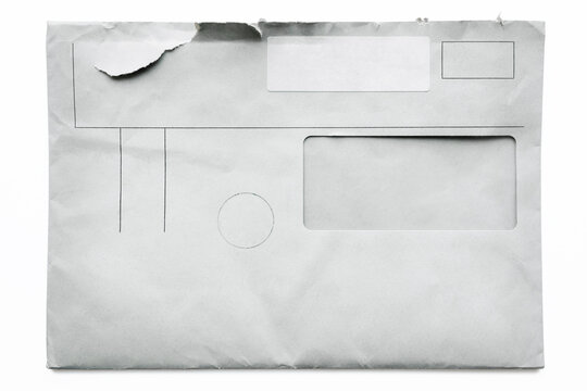 Torn Business envelope, close-up. Isolated on white background